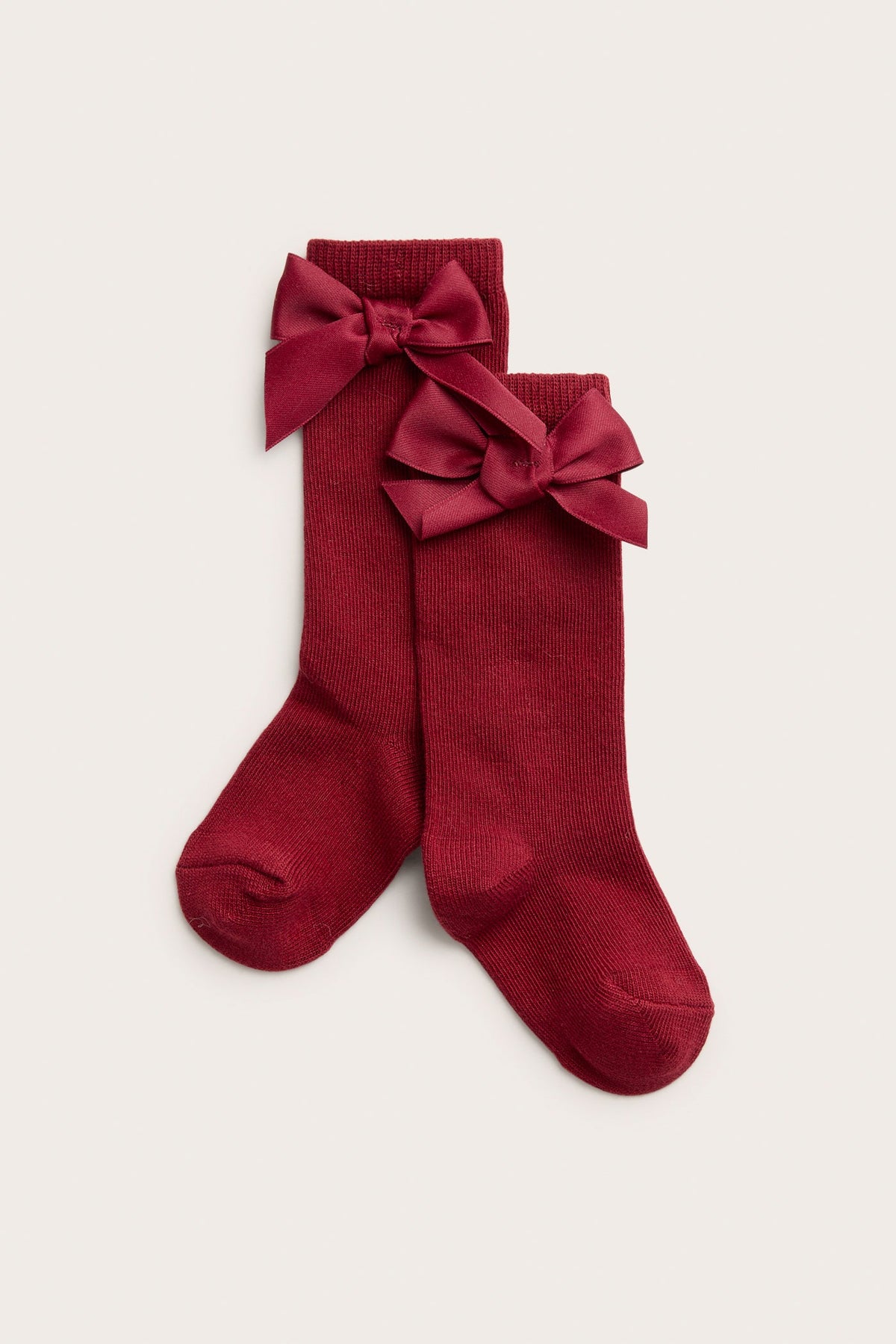 Baby red knee-highs with satin bow